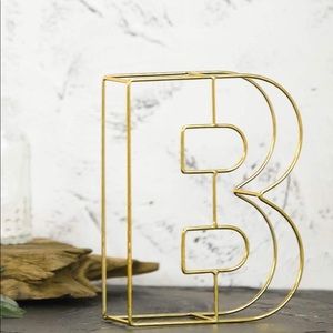 Gold metal letter “B”
